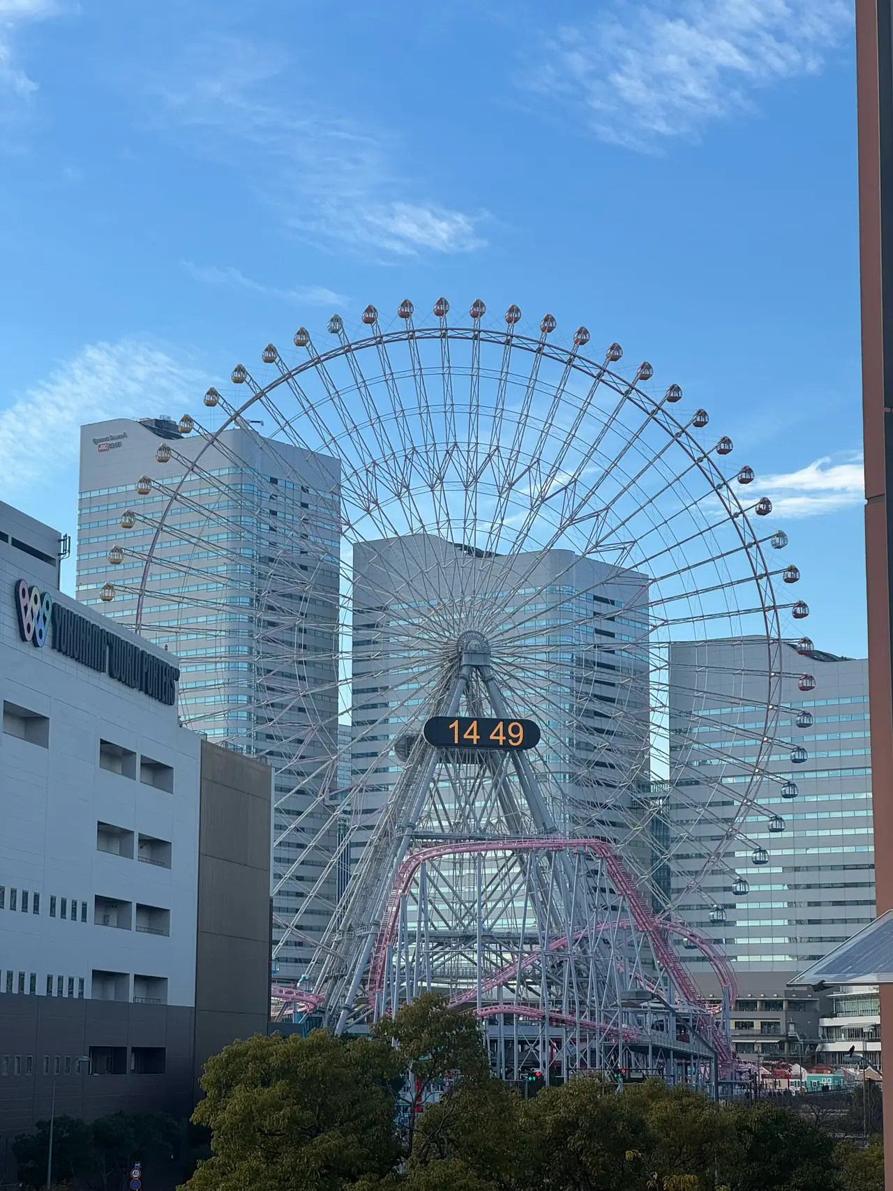The Cosmo Clock ferris wheel reads 14:49 above the buildings of Minato Mirai.